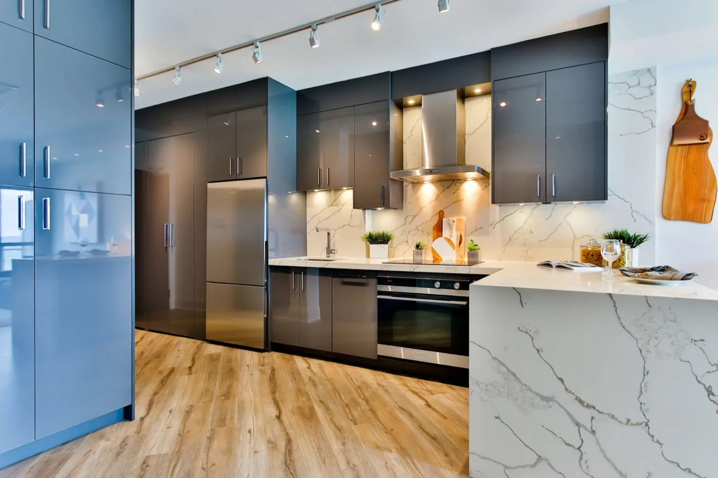modern dark kitchen with marble countertops and custom cabinetry – Temecula CA