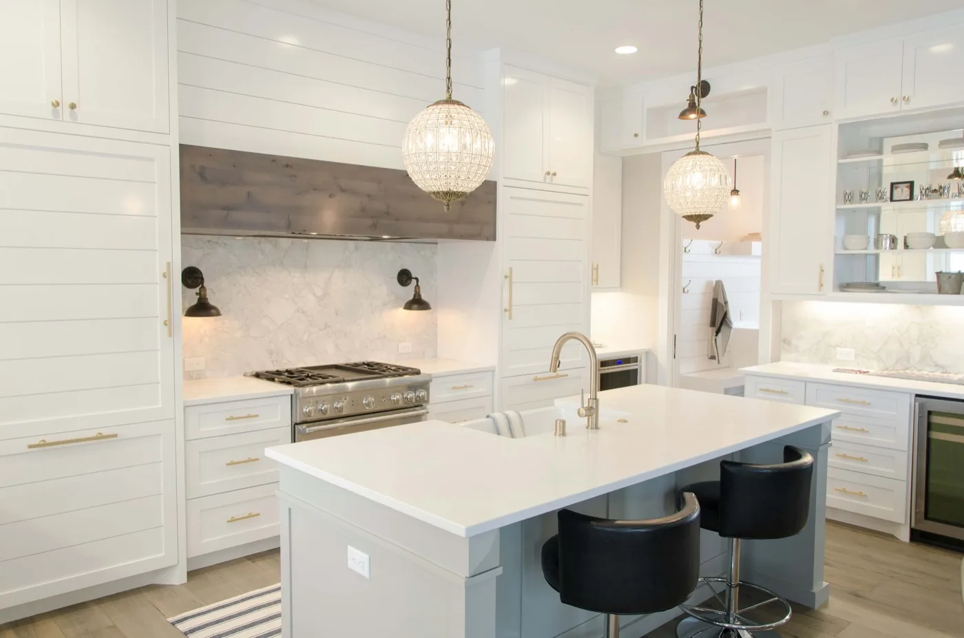 Hampton-style white kitchen with large island and gold pendant lights – Temecula CA