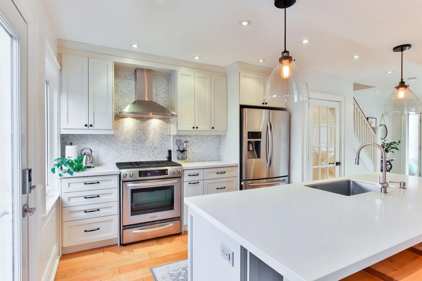 white Shaker kitchen remodel with quartz countertops and stainless appliances – Temecula CA